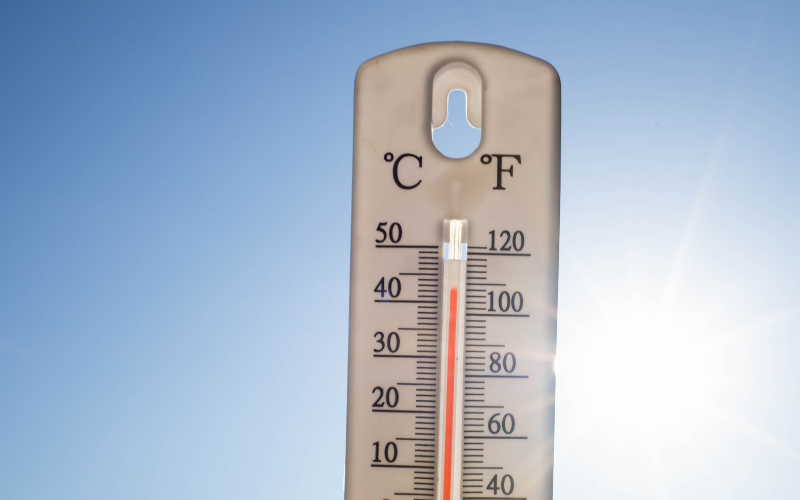 Thermometer outside showing extreme warm temperatures