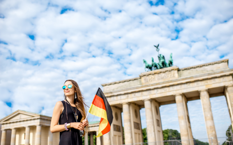 Woman holding German flag in Berlin