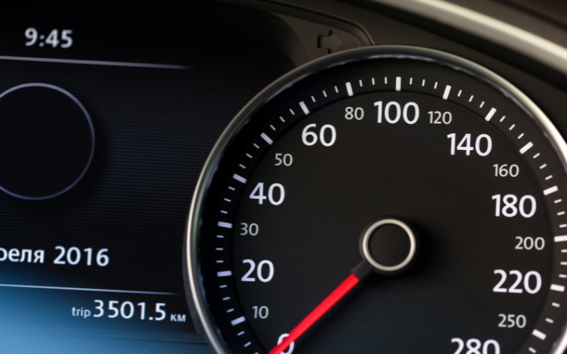 Close-up of a vehicle's speedometer in the interior